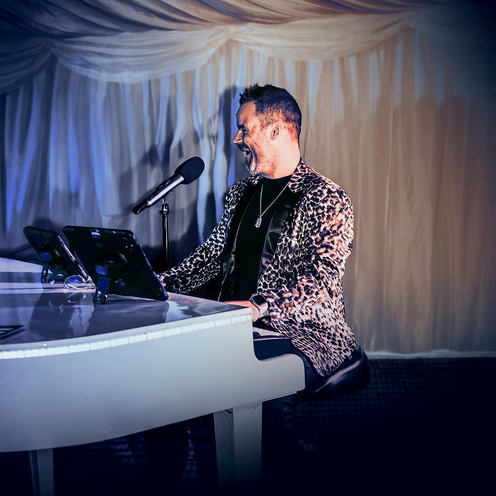 Carl Williams entertaining at a party